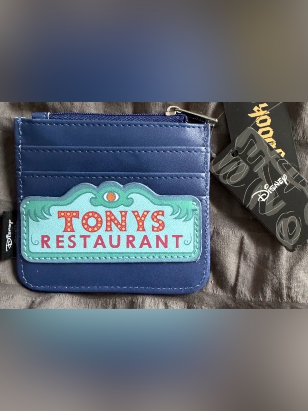 Disney Lady & Tramp Zip Cardholder features a Tony's Restaurant sign design